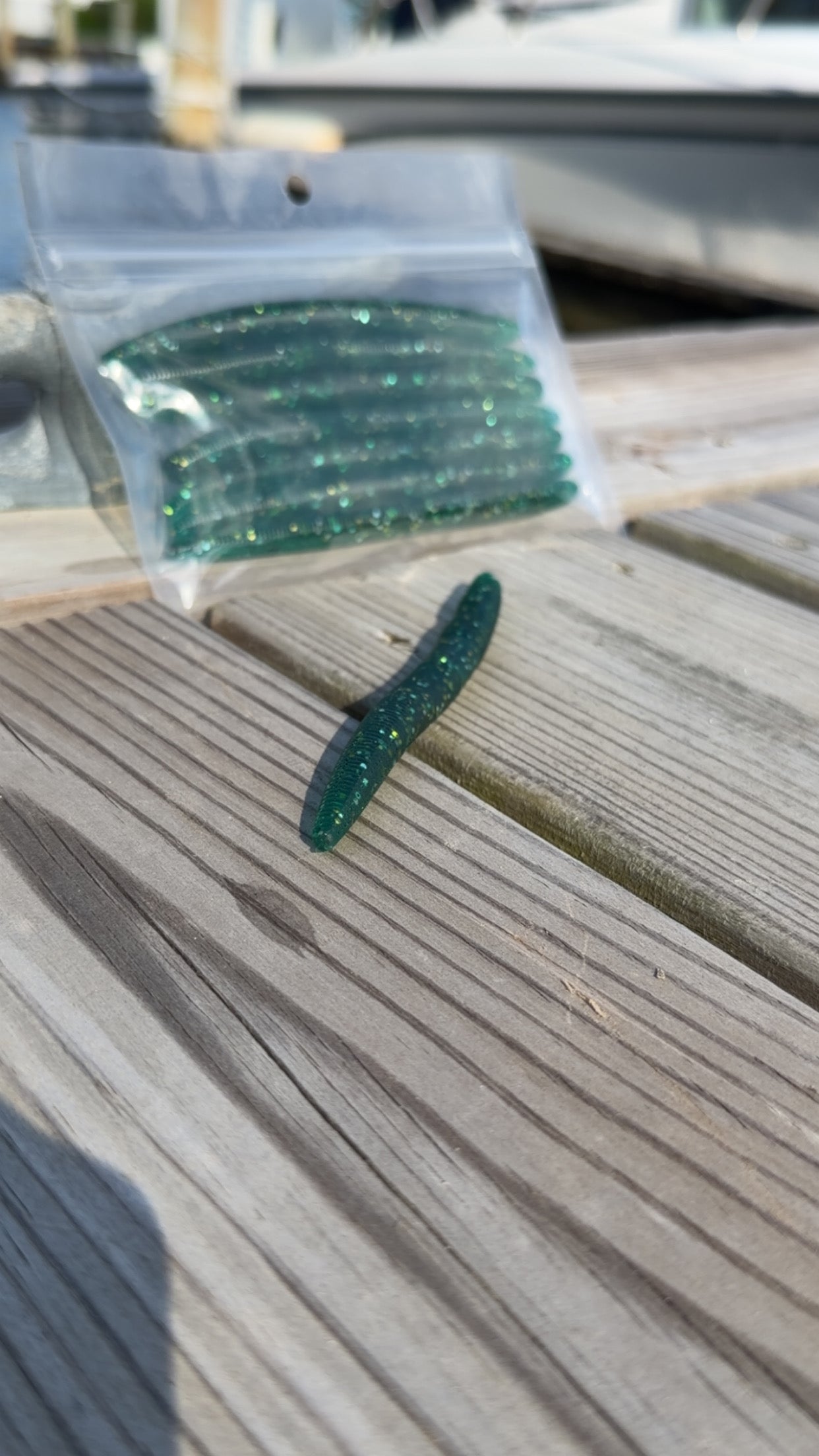 Bait Bros Tackle 5-inch stick bait for fishing, showcasing the soft plastic lure in vibrant colors on a plain background.