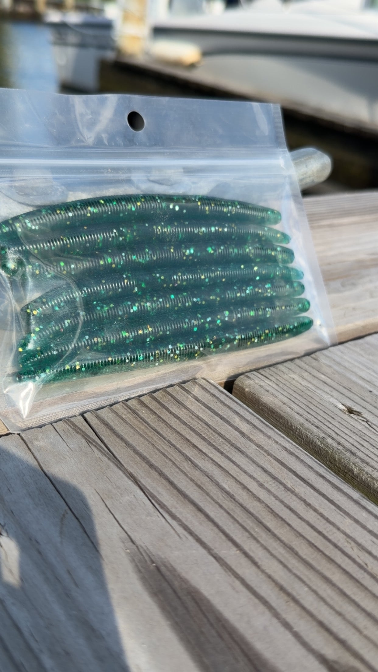 Bait Bros Tackle 5-inch stick bait lure in vibrant colors, designed for freshwater and saltwater fishing.