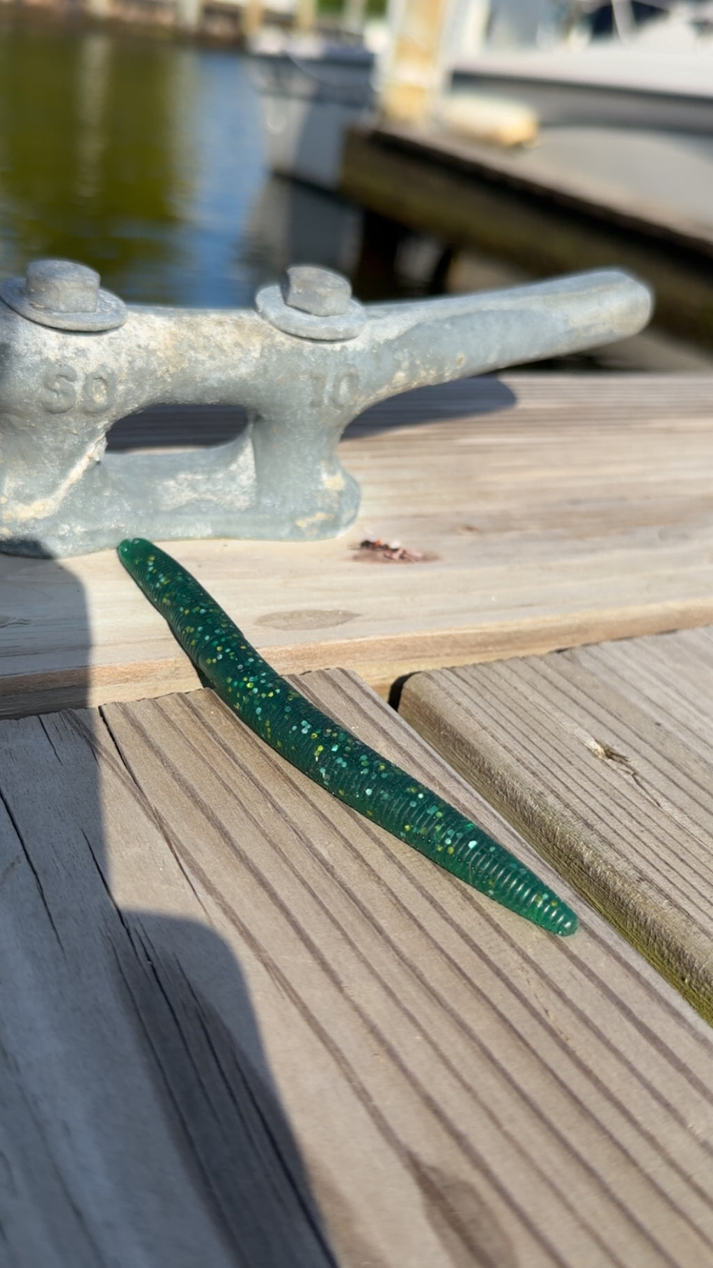 Bait Bros Tackle 5-inch stick bait lure for freshwater fishing, showcasing the colorful soft plastic bait on a fishing hook.